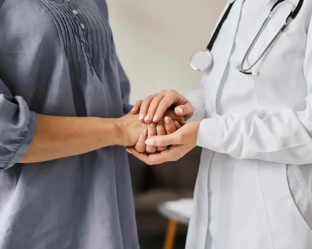 recovery-center-female-doctor-holding-older-patient-s-hands