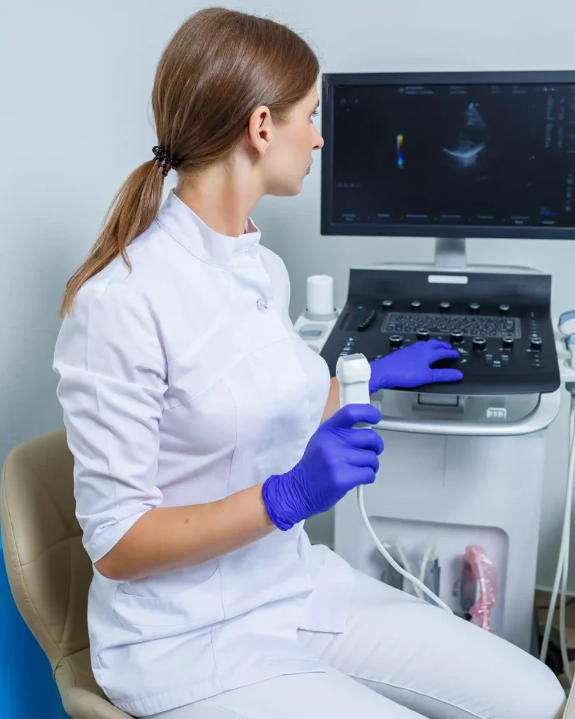 young-woman-is-intern-doctor-she-is-white-suit-medical-gloves-holding-ultrasound-probe-her-hands-ultrasound-diagnostics-selective-focus